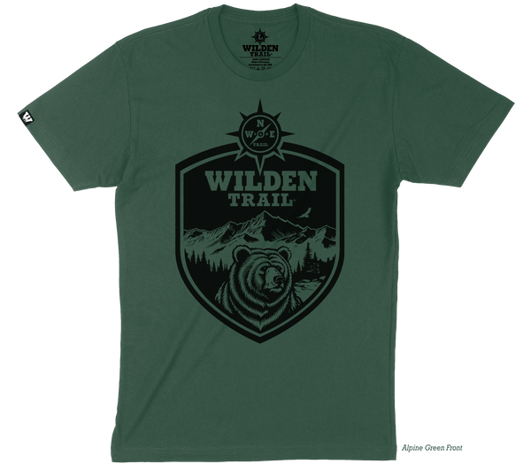 Emblem design with a black bear, mountains, and compass logo inside the emblem with the words "Wilden Trail" at the top.
