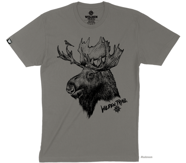 A gray brown colored tshirt with a moose sketched image on the front of the tshirt. There is a small bird on the Moose's antler. The words "Wilden Trail" and the logo appear on the bottom right hand side of the image.